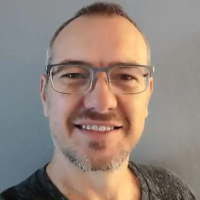 Person with glasses and short hair