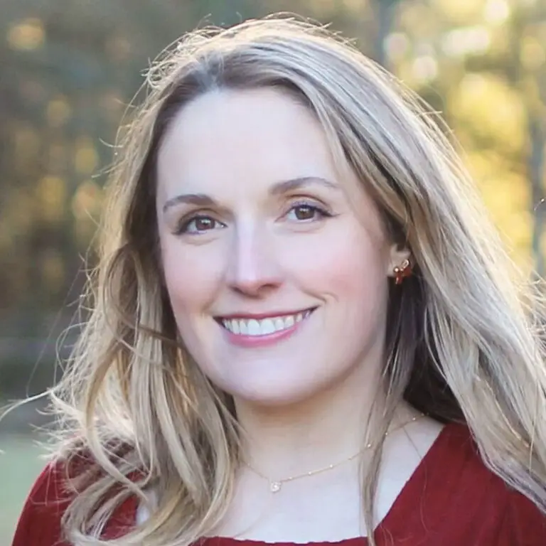 Woman with long, wavy blonde hair.